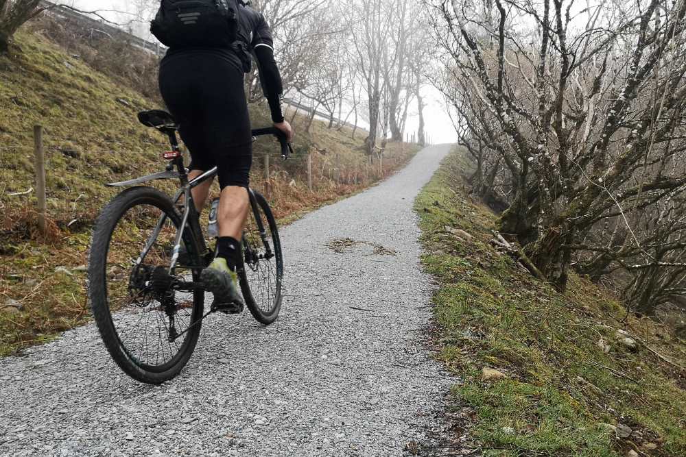 Cyclist going uphill on the South Loch Ness Trail