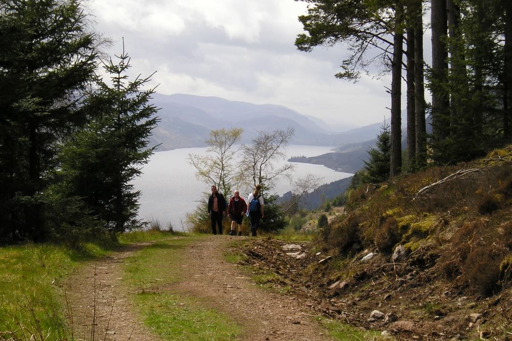 Walkers on the Great Glen Way high route overlooking Loch Ness